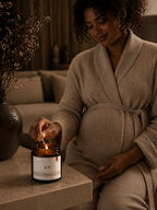Pregnant woman enjoying calming candle ritual with Joy botanical candle